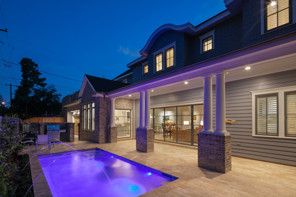 Pool fountain - huge transitional backyard brick and rectangular pool fountain idea in Houston