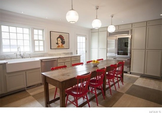 Photo of a large traditional l-shaped eat-in kitchen in Other with a farmhouse sink, raised-panel cabinets, white cabinets, granite benchtops, stainless steel appliances and no island.