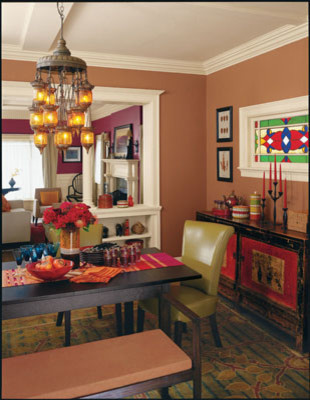 Idee per una sala da pranzo boho chic con pareti arancioni