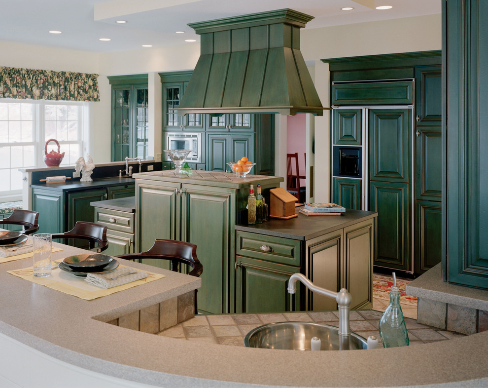 Large country u-shaped kitchen in Boston with raised-panel cabinets, green cabinets, with island, a single-bowl sink, tile benchtops, stone tile splashback, stainless steel appliances and ceramic floors.