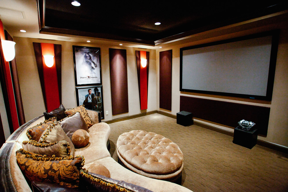 This is an example of a mid-sized traditional enclosed home theatre in Other with beige walls, carpet, a wall-mounted tv and grey floor.