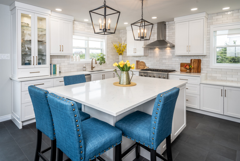 Inspiration for a mid-sized transitional l-shaped ceramic tile and gray floor eat-in kitchen remodel with an undermount sink, white cabinets, quartz countertops, white backsplash, ceramic backsplash, stainless steel appliances, an island and white countertops