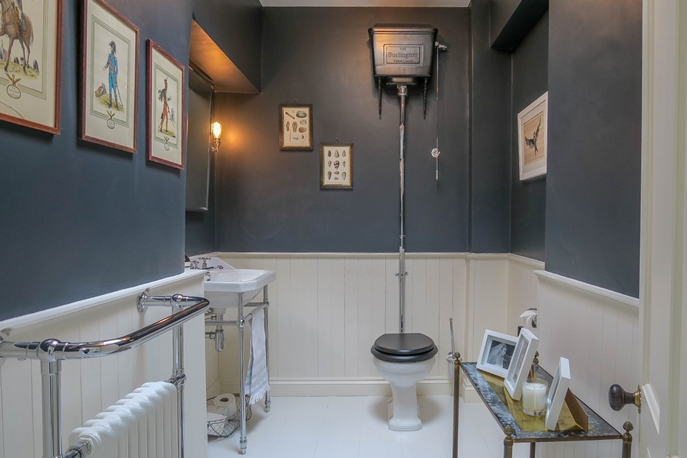 Design ideas for a large traditional kids bathroom in London with a two-piece toilet, white tile, grey walls, painted wood floors, a console sink and white floor.