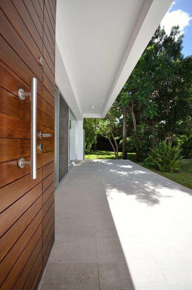 This is an example of a modern verandah in Other.