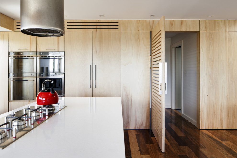 Contemporary kitchen in Sydney with flat-panel cabinets and light wood cabinets.