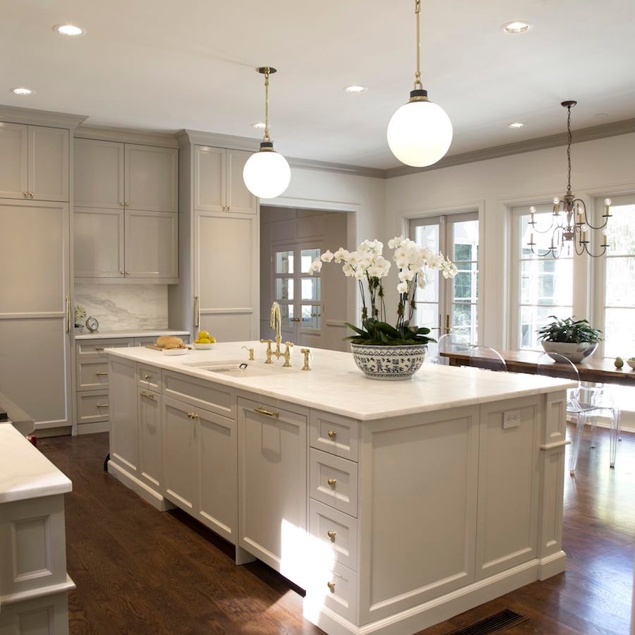 Huge transitional dark wood floor kitchen photo in Austin with an undermount sink, recessed-panel cabinets, gray cabinets, marble countertops, white backsplash, marble backsplash, stainless steel appliances and an island