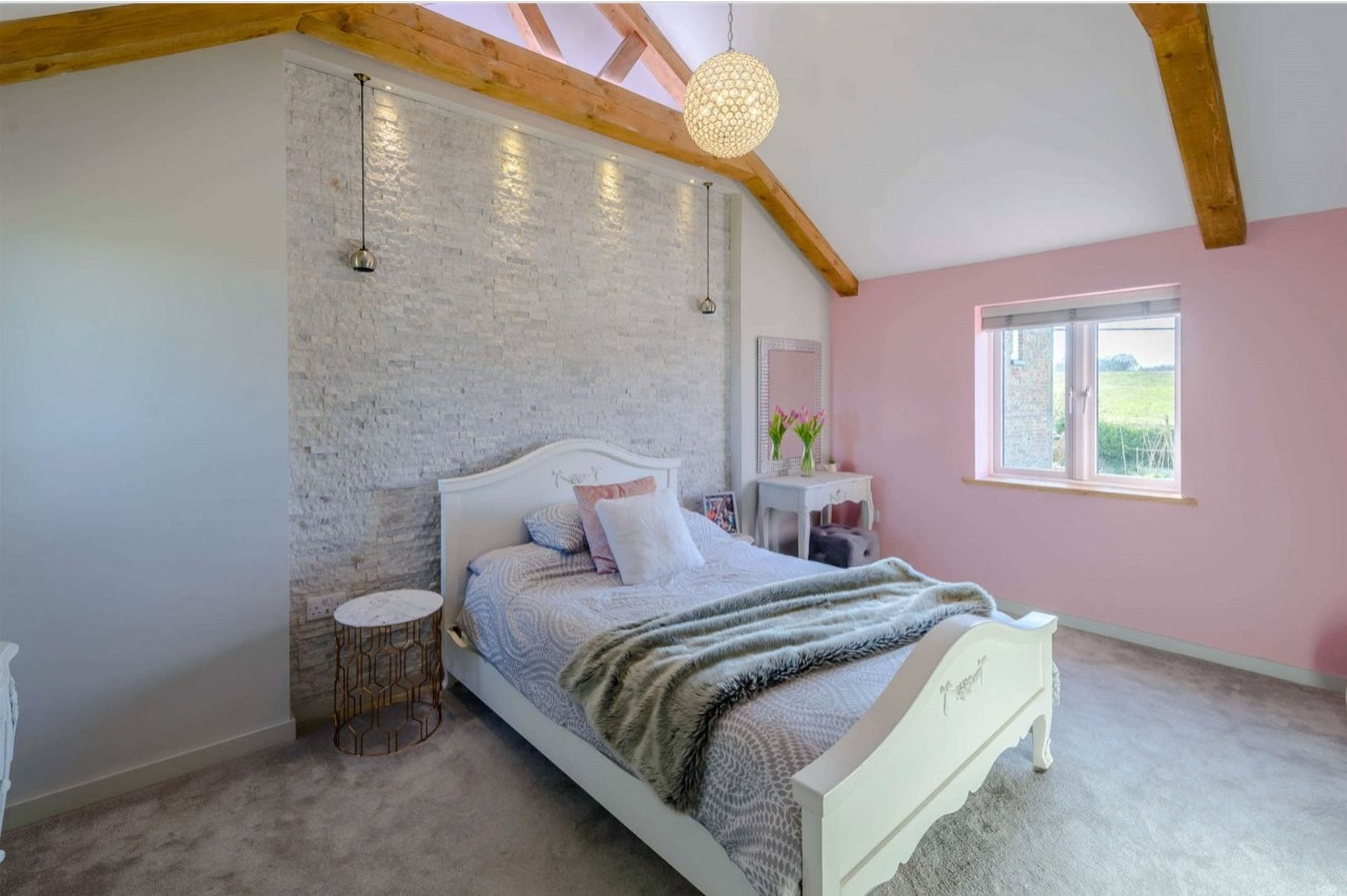 Girl's bedroom with split-face tile feature wall