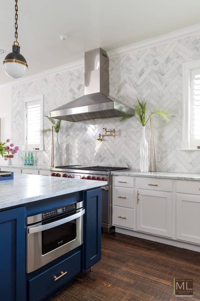 Large transitional dark wood floor kitchen photo in Dallas with a farmhouse sink, shaker cabinets, white cabinets, marble countertops, gray backsplash, ceramic backsplash, stainless steel appliances and an island
