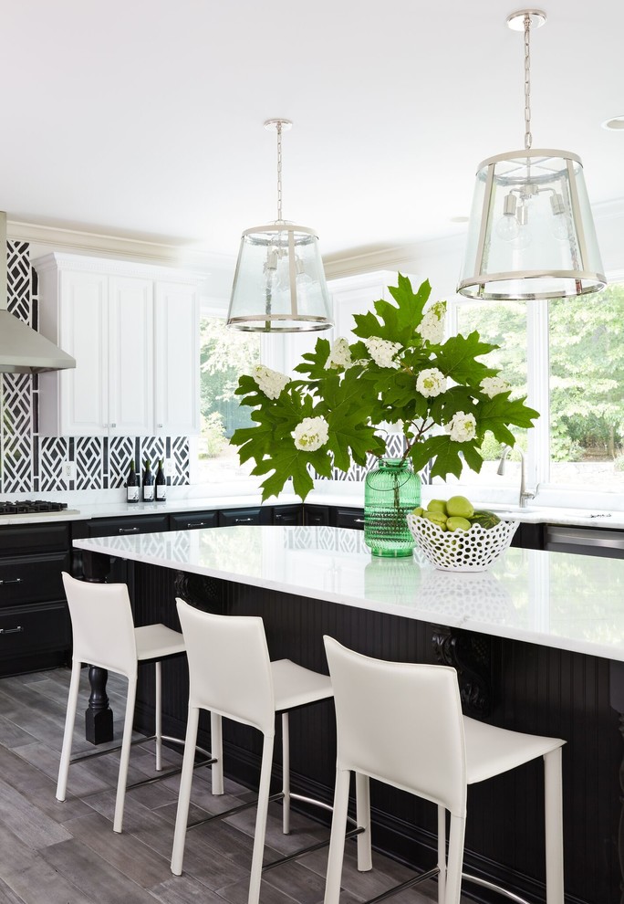 Kitchen - transitional gray floor kitchen idea in DC Metro with an island and white countertops