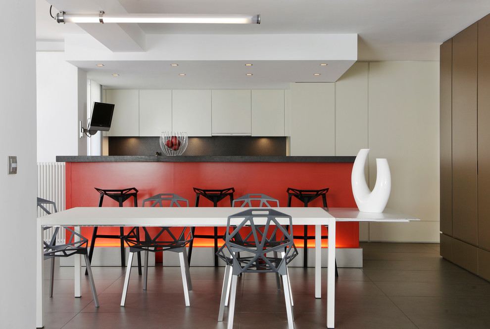 Photo of a mid-sized contemporary kitchen/dining combo in Marseille with ceramic floors, no fireplace and white walls.