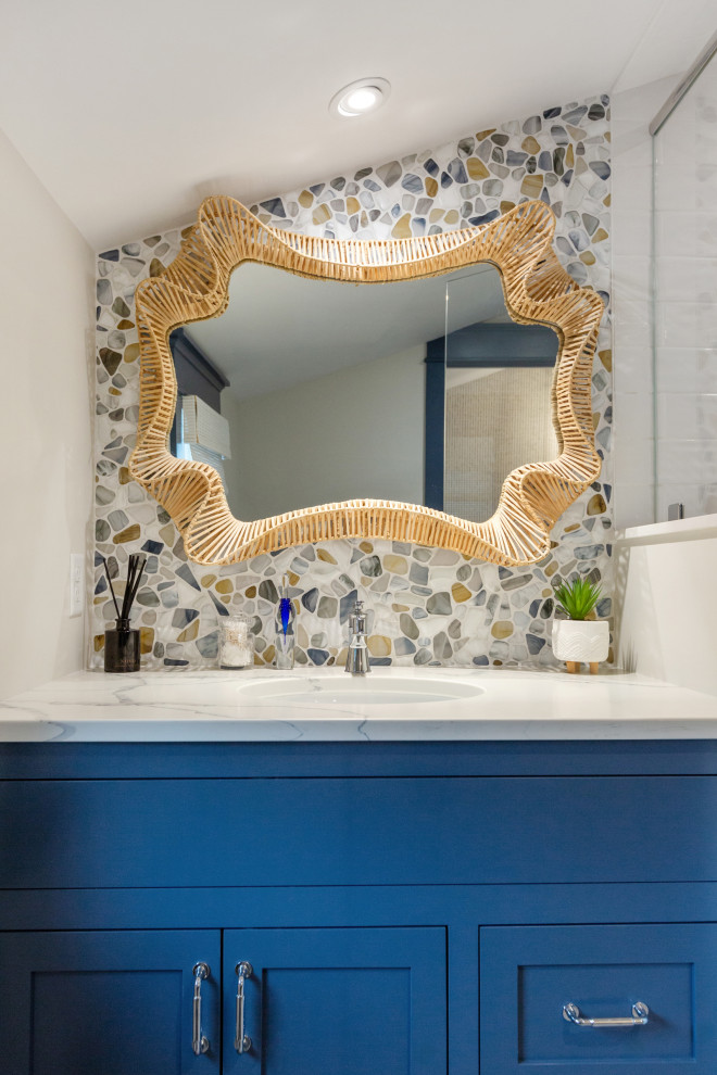 Inspiration for a mid-sized coastal 3/4 multicolored tile and glass sheet ceramic tile, blue floor and single-sink corner shower remodel in Boston with shaker cabinets, blue cabinets, a one-piece toilet, gray walls, an undermount sink, quartz countertops, a hinged shower door and a built-in vanity