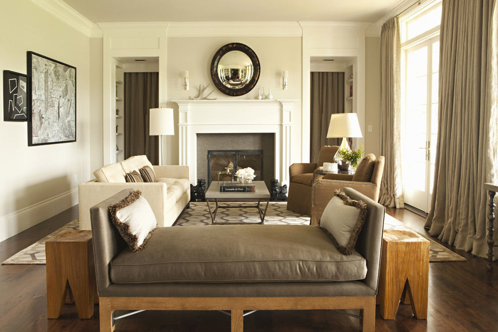 Transitional living room in Los Angeles with beige walls, dark hardwood floors and a standard fireplace.