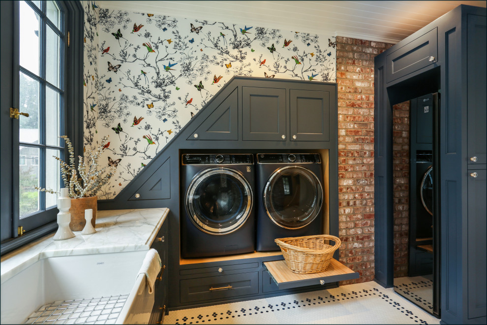 Large traditional u-shaped dedicated laundry room in Portland with an undermount sink, shaker cabinets, blue cabinets, marble benchtops, multi-coloured walls, porcelain floors, a side-by-side washer and dryer, multi-coloured floor, white benchtop, timber and wallpaper.