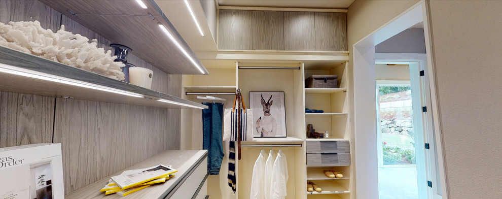 Walk-in closet - large contemporary men's carpeted and beige floor walk-in closet idea in Portland with flat-panel cabinets and white cabinets