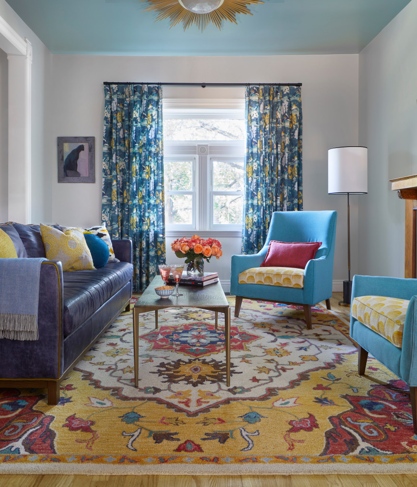 Transitional enclosed living room in Denver with grey walls, medium hardwood floors and brown floor.