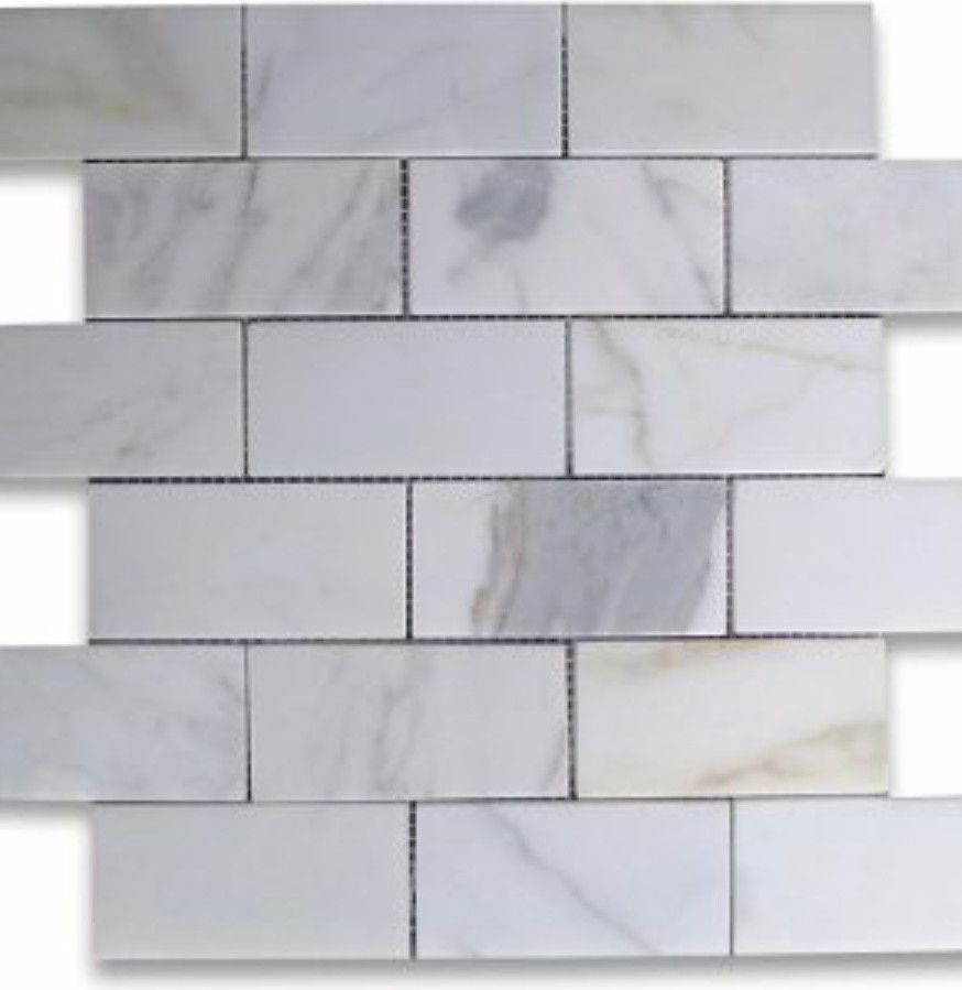 marble look alike countertops with real marble backsplash?
