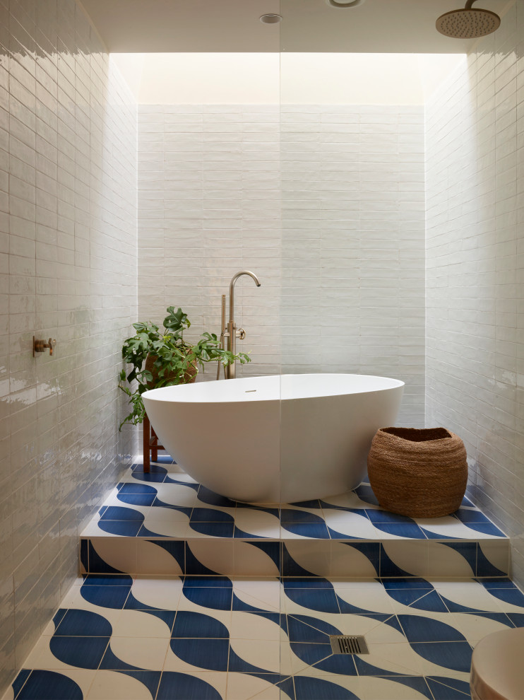Inspiration for a midcentury bathroom in Other with dark wood cabinets, a freestanding tub, an open shower, a one-piece toilet, multi-coloured tile, ceramic tile, white walls, ceramic floors, a console sink, engineered quartz benchtops, blue floor, an open shower, a double vanity and a built-in vanity.