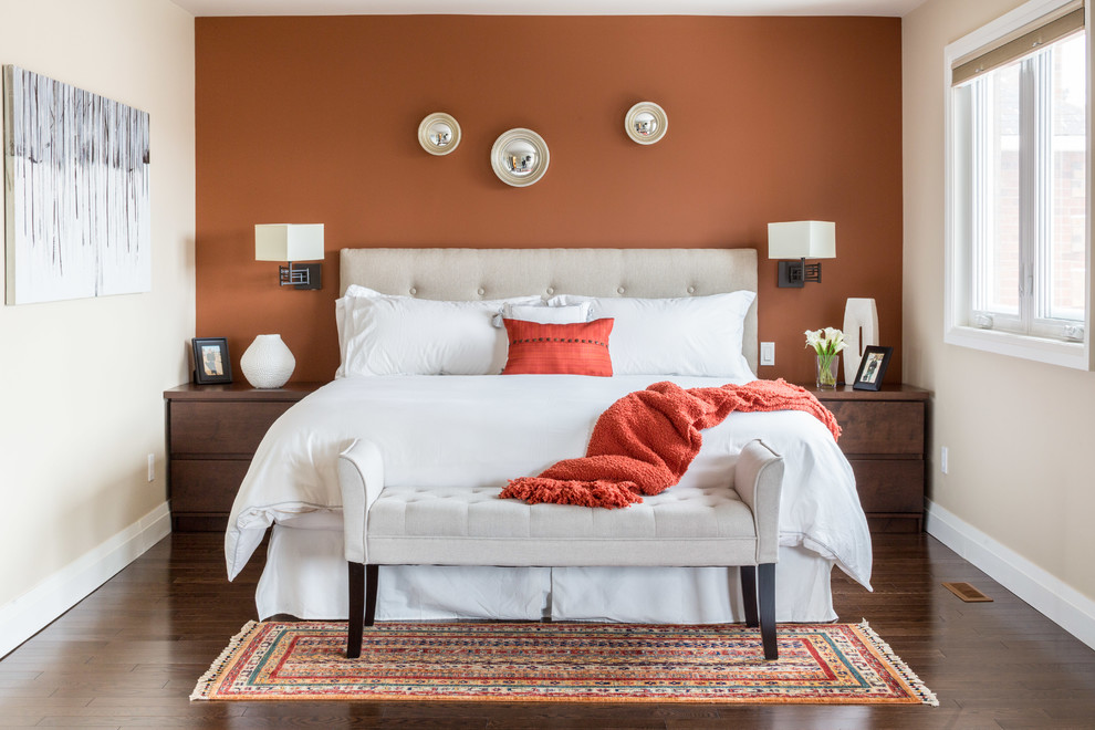 Inspiration for a mid-sized transitional master bedroom in Toronto with orange walls, dark hardwood floors and no fireplace.