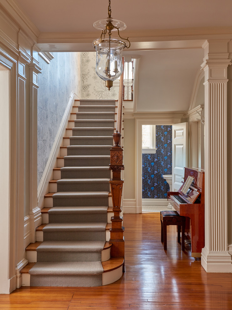 Inspiration for a transitional wooden straight wood railing staircase remodel in New York with painted risers