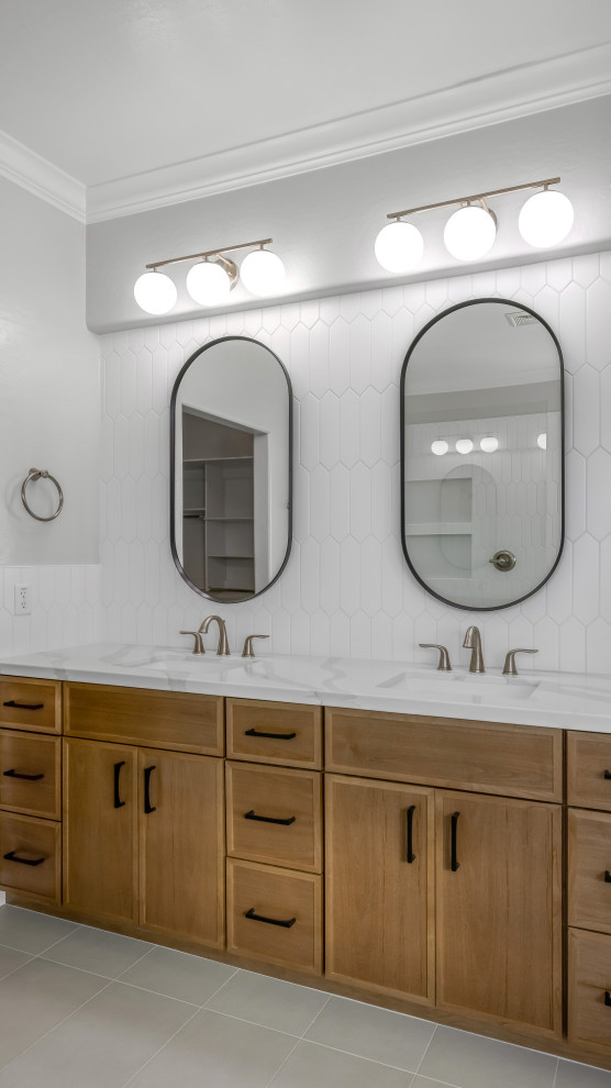 Photo of a large modern master bathroom in Phoenix with shaker cabinets, medium wood cabinets, white tile, ceramic tile, grey walls, porcelain floors, an undermount sink, engineered quartz benchtops, grey floor, white benchtops, a double vanity and a built-in vanity.
