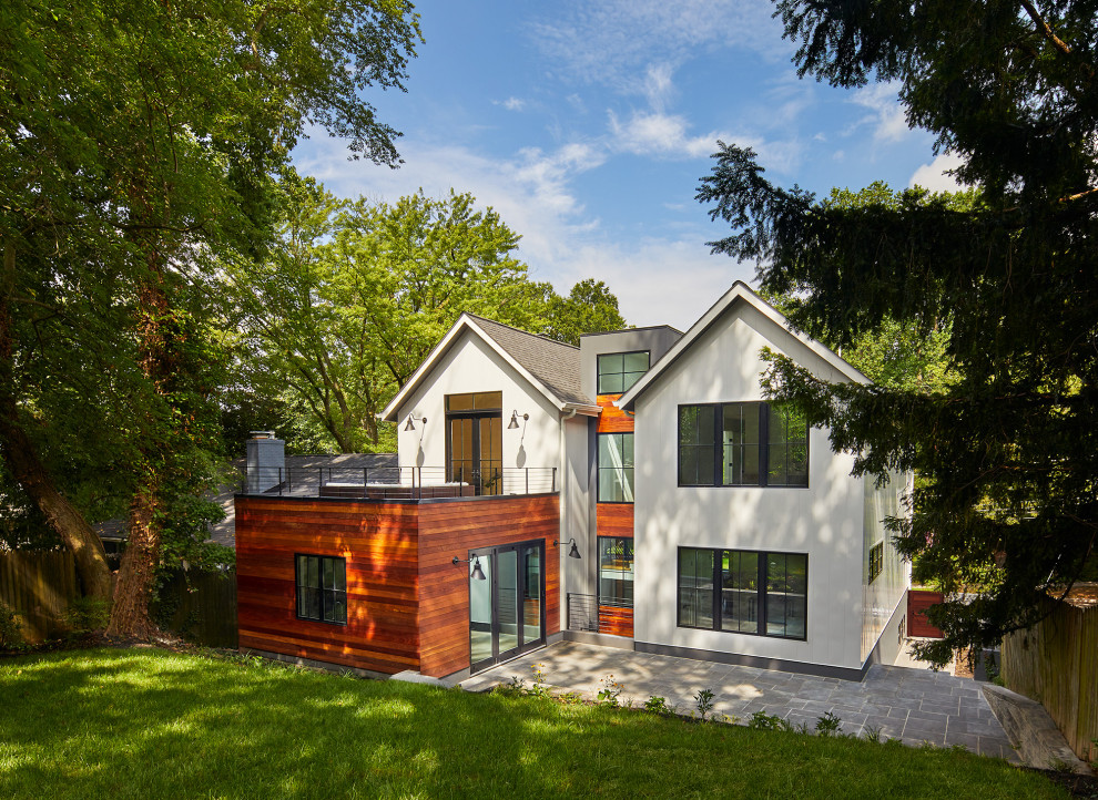 Inspiration for a large contemporary white one-story wood exterior home remodel in DC Metro with a shingle roof and a black roof