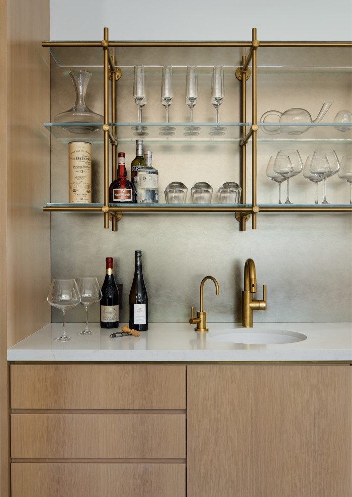 Photo of a large contemporary home bar in San Francisco with an undermount sink and white benchtop.