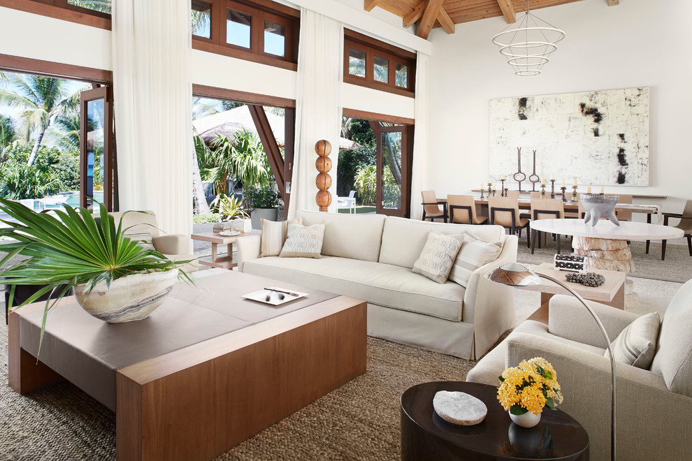 Inspiration for a tropical open concept living room in Chicago with white walls.