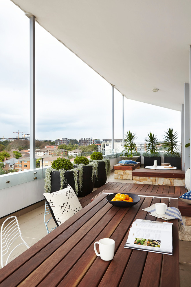 This is an example of a mid-sized contemporary rooftop outdoor sport court in Sydney with decking.