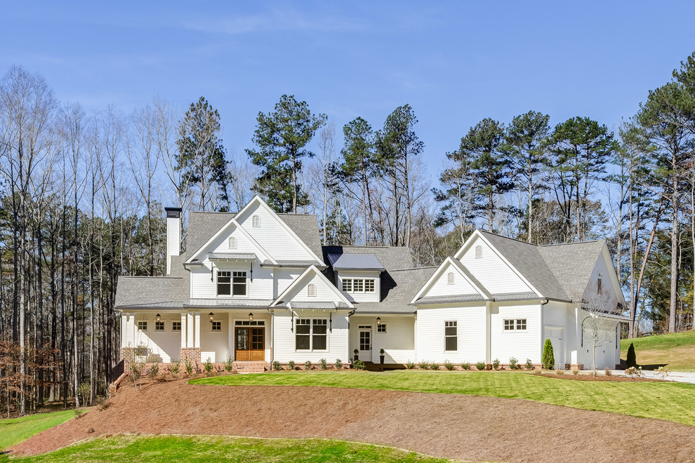 This is an example of a transitional white exterior in Atlanta with a gable roof.