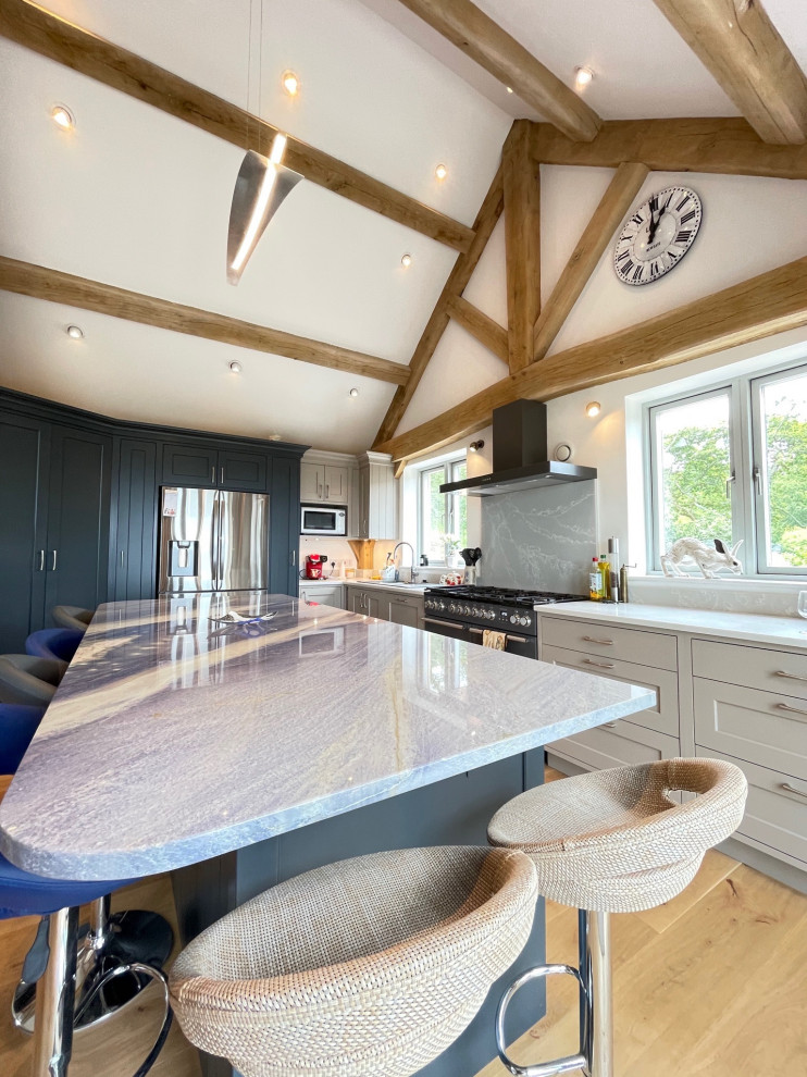 Traditional painted shaker kitchen with sea view