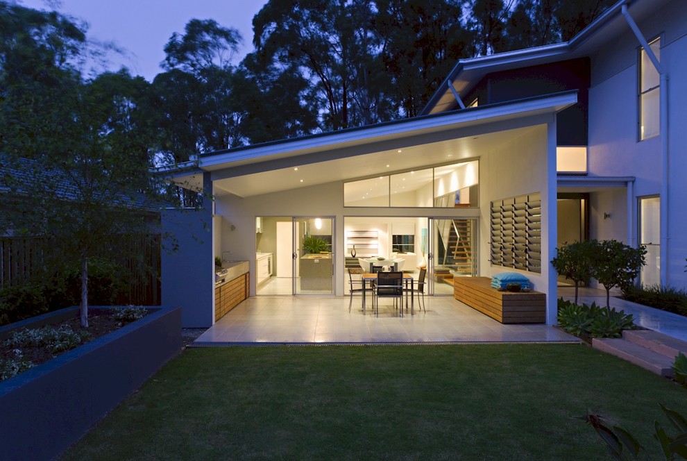 Inspiration for a mid-sized contemporary patio in Brisbane with a roof extension.