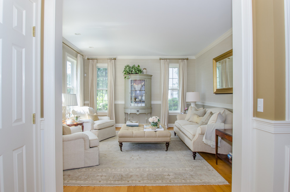 This is an example of a mid-sized traditional formal enclosed living room in Bridgeport with beige walls and light hardwood floors.