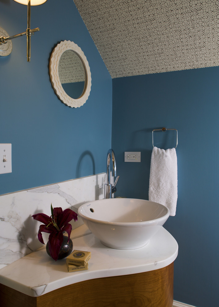 Photo of a beach style bathroom in Boston with a vessel sink and blue walls.