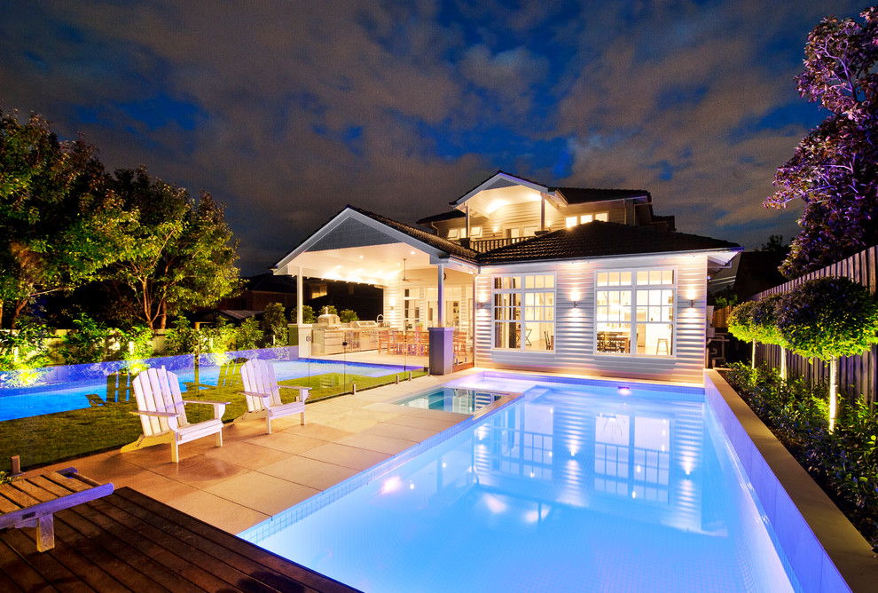 This is an example of a large traditional two-storey beige exterior in Melbourne with wood siding.