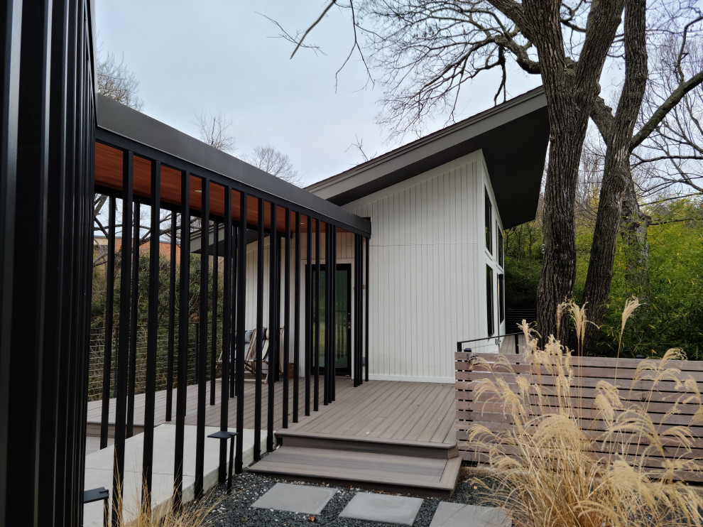 Medium sized and white midcentury bungalow tiny house in Dallas with mixed cladding, a lean-to roof, a shingle roof, a black roof and shiplap cladding.