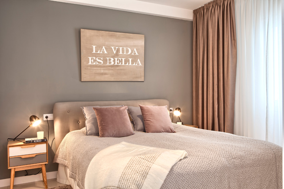 Design ideas for a mid-sized scandinavian master bedroom in Malaga with beige walls.