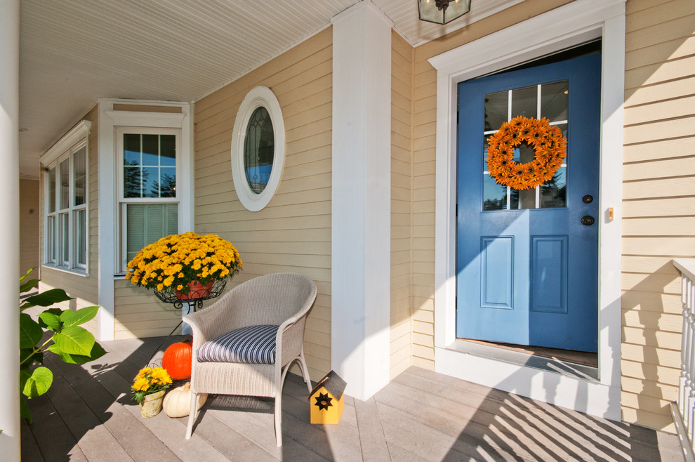 Photo of a traditional entryway in Boston with a blue front door.