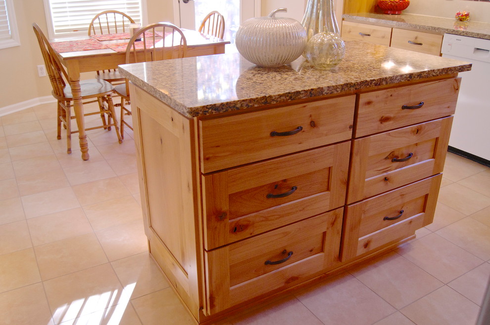 Inspiration for a transitional l-shaped porcelain tile eat-in kitchen remodel with an undermount sink, flat-panel cabinets, light wood cabinets, quartz countertops, beige backsplash, ceramic backsplash, white appliances and an island
