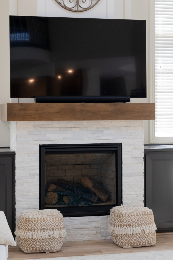 Modern Living Room Design with a TV Centered Above a Contemporary Fireplace