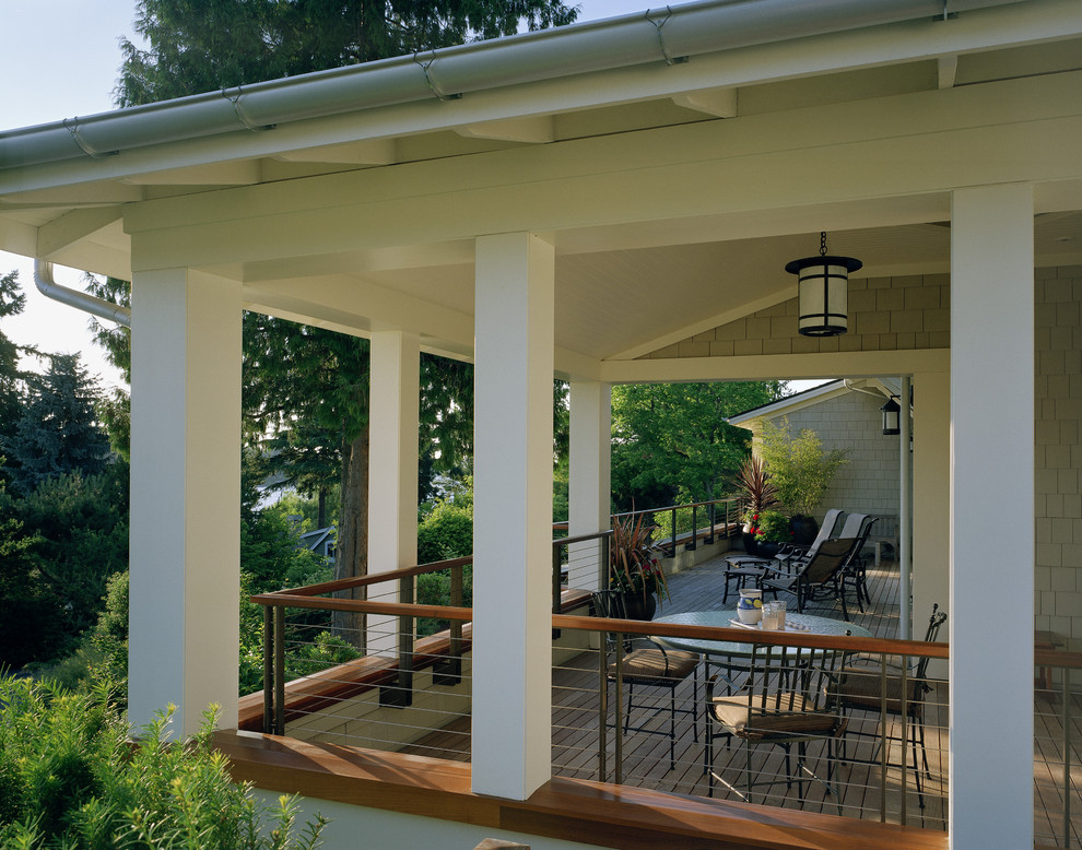 Inspiration for a traditional verandah in Seattle with decking and a roof extension.