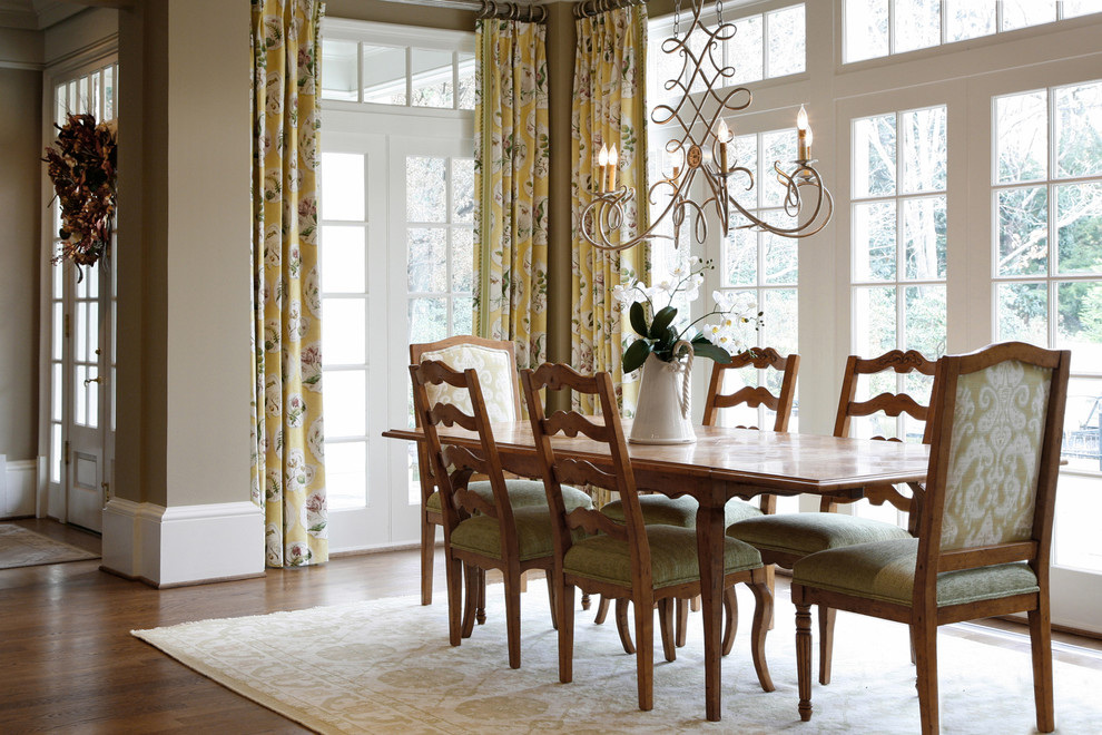 Traditional separate dining room in Atlanta with beige walls and medium hardwood floors.