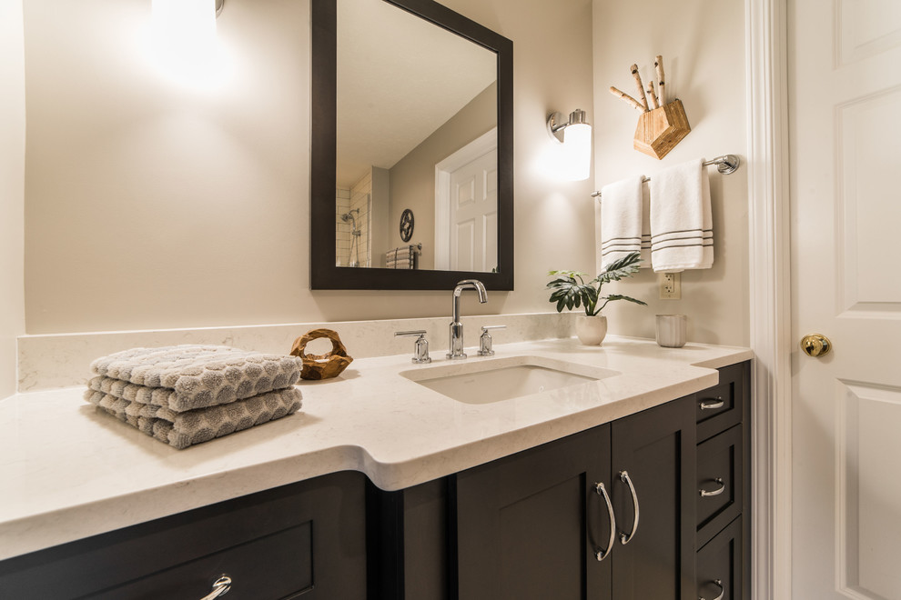 Inspiration for a mid-sized contemporary 3/4 wet room bathroom in Chicago with shaker cabinets, brown cabinets, a one-piece toilet, beige walls, ceramic floors, an undermount sink, engineered quartz benchtops, beige floor, a hinged shower door and beige benchtops.