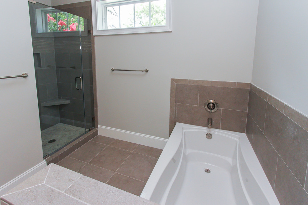 This is an example of a mid-sized modern master bathroom in Atlanta with a drop-in sink, raised-panel cabinets, white cabinets, granite benchtops, a corner tub, a corner shower, a two-piece toilet, beige tile, ceramic tile, white walls and ceramic floors.