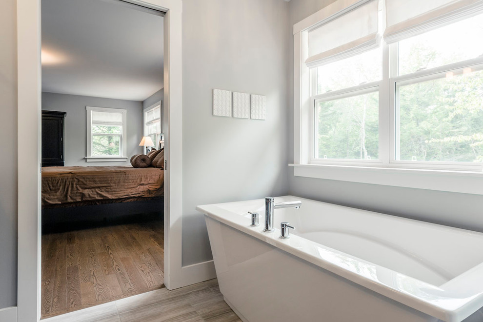 Huge transitional master gray tile and glass tile ceramic tile freestanding bathtub photo with a vessel sink, dark wood cabinets, marble countertops, gray walls and shaker cabinets