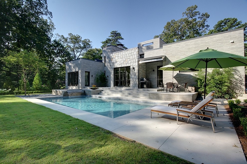 Pool - contemporary stamped concrete and rectangular pool idea in Atlanta