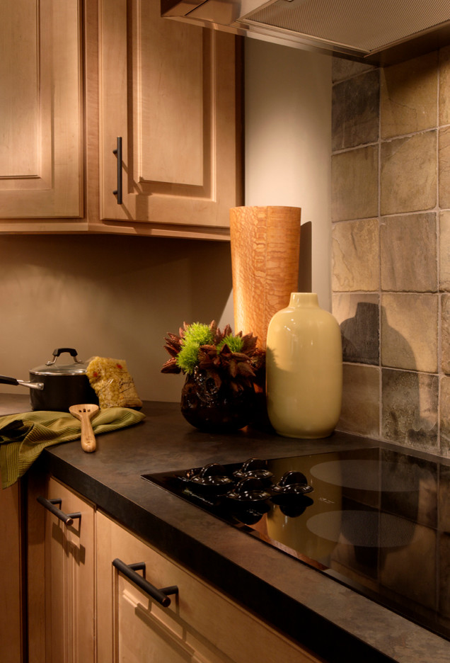 Large mountain style slate floor and gray floor enclosed kitchen photo in Chicago with a double-bowl sink, raised-panel cabinets, medium tone wood cabinets, granite countertops, gray backsplash, slate backsplash, stainless steel appliances and an island