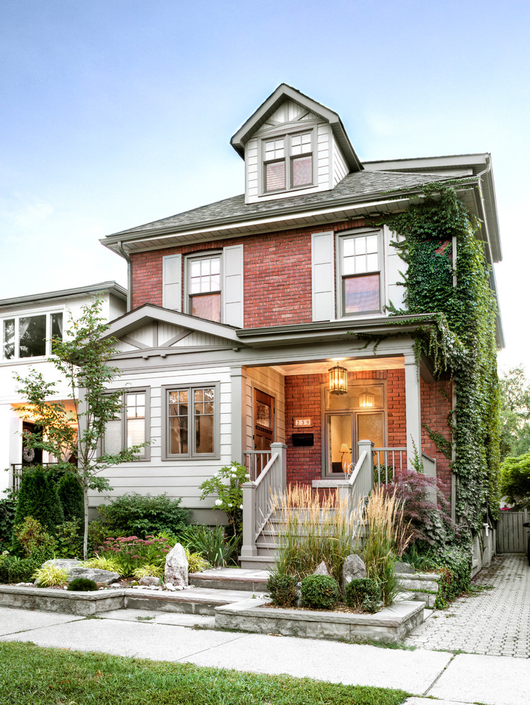 This is an example of a traditional two-storey brick red exterior in Toronto.