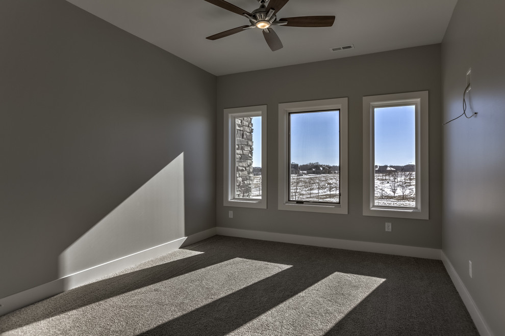 Example of a transitional home design design in Omaha