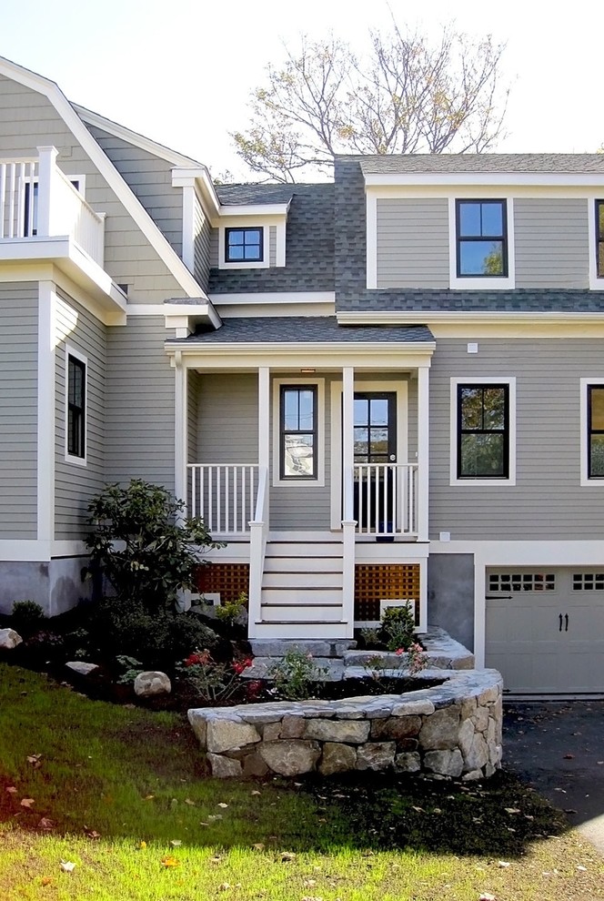Photo of a mid-sized traditional three-storey grey house exterior in Boston with wood siding and a shingle roof.