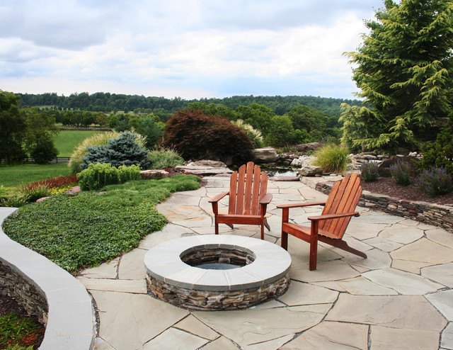 Stacked stone fire pit with seating area - Traditional ...